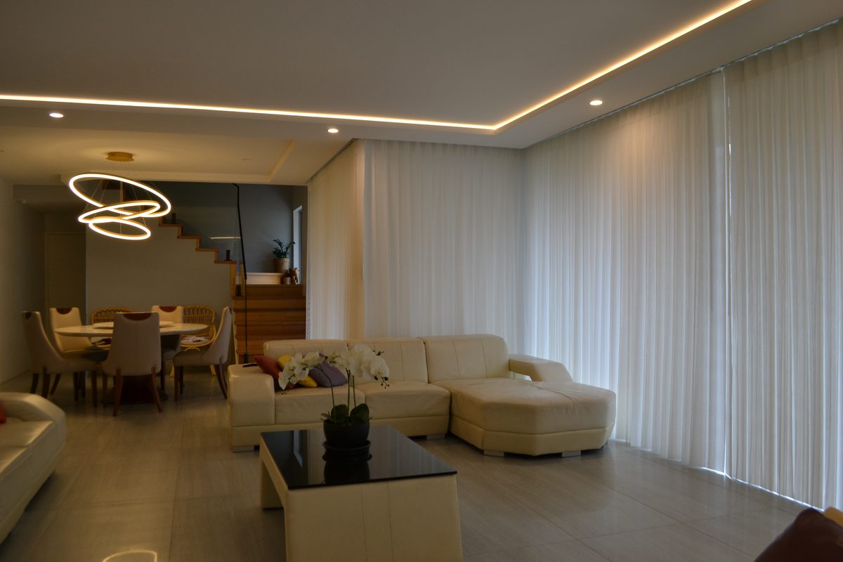 A sunlit Perth living room dressed in sheer curtains